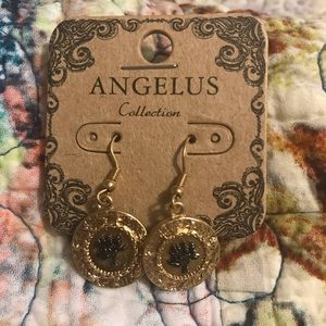 Brand new earrings detailed with trees